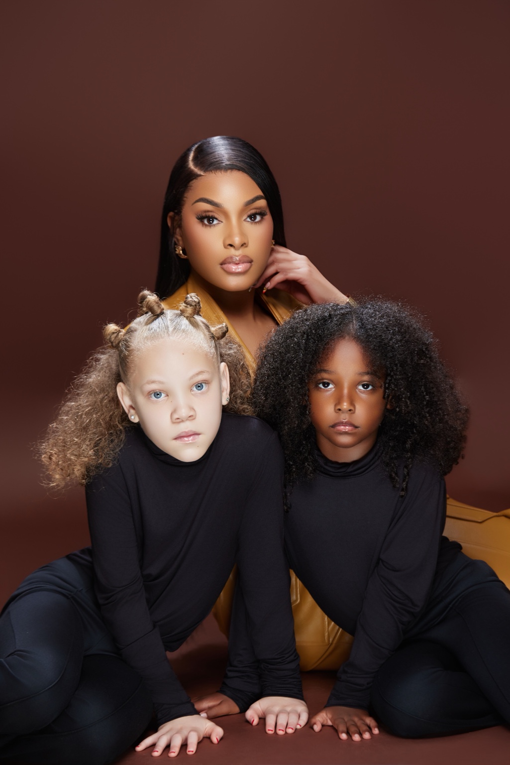 Kennedy with two mini clients showcasing natural hairstyles